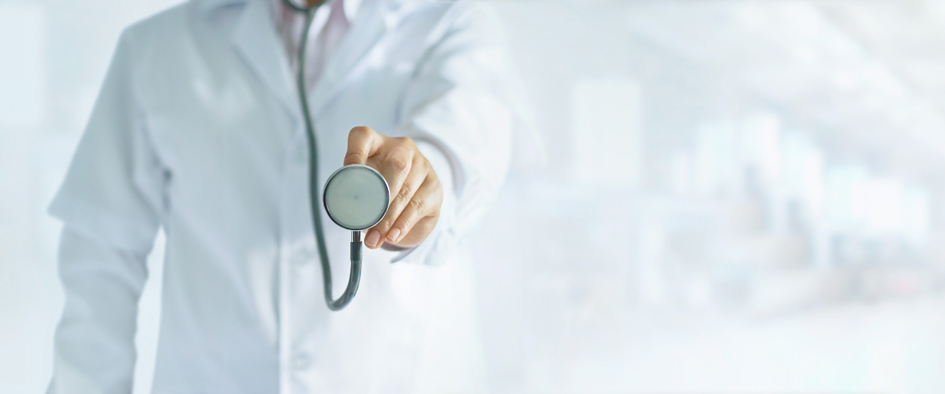 Medicine doctor holding stethoscope in hand on hospital backgrou